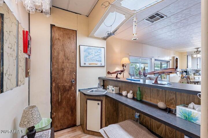 201 South Greenfield Road, Unit 142 Mesa, AZ 85206 - Photo 28 of 53 a room with stainless steel appliances lots of wooden furniture