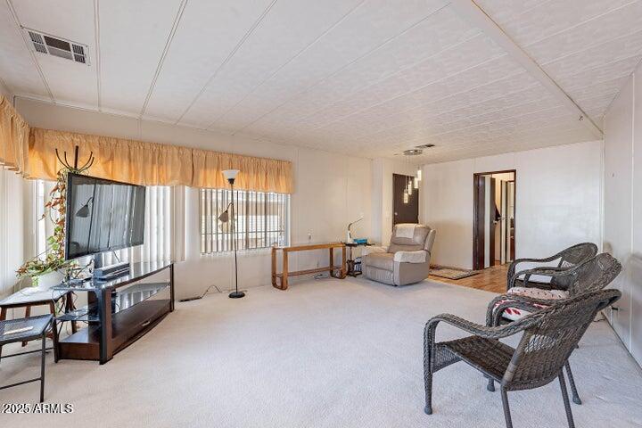 201 South Greenfield Road, Unit 142 Mesa, AZ 85206 - Photo 2 of 53 a living room with furniture and a flat screen tv