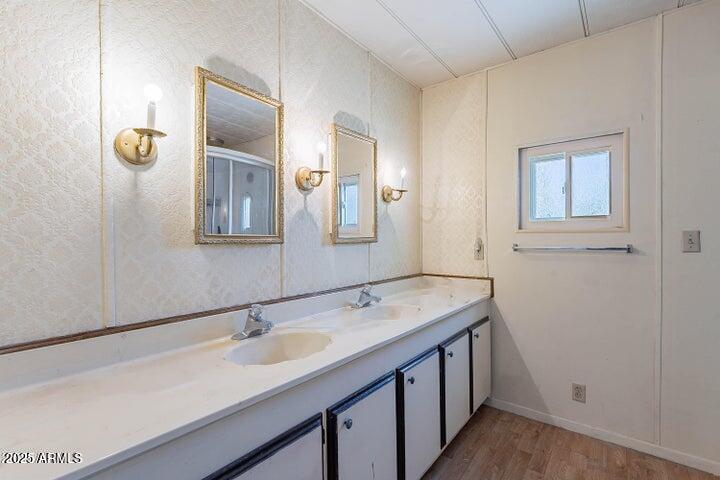 201 South Greenfield Road, Unit 142 Mesa, AZ 85206 - Photo 32 of 53 a bathroom with a sink and a mirror