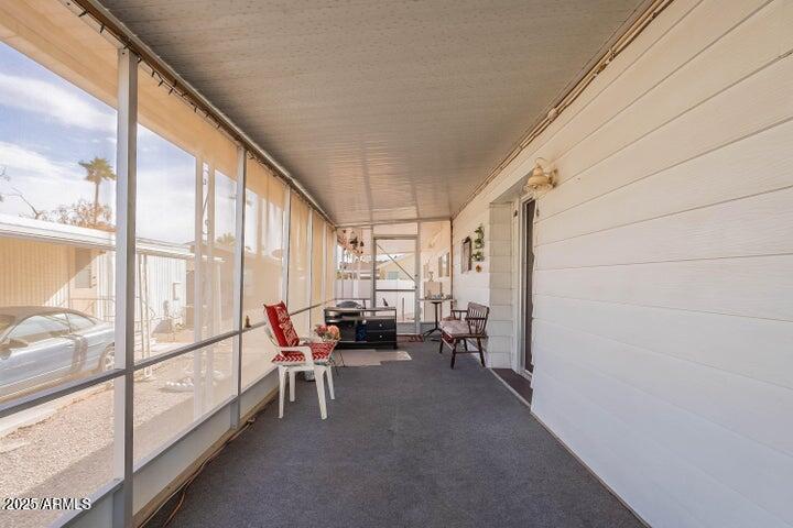 201 South Greenfield Road, Unit 142 Mesa, AZ 85206 - Photo 35 of 53 a view of living room with furniture and floor to ceiling window