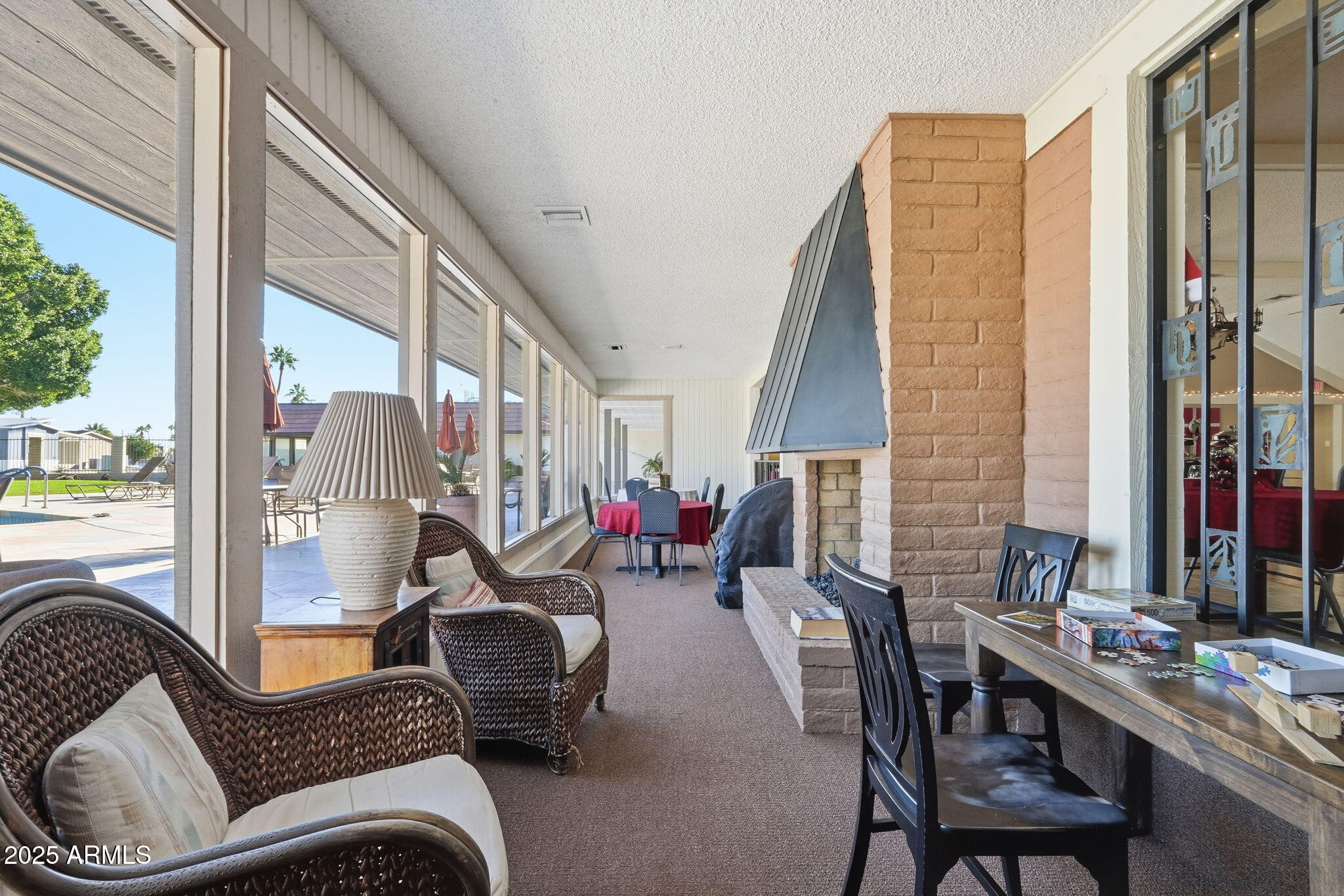 201 South Greenfield Road, Unit 142 Mesa, AZ 85206 - Photo 41 of 53 a living room with furniture and floor to ceiling windows