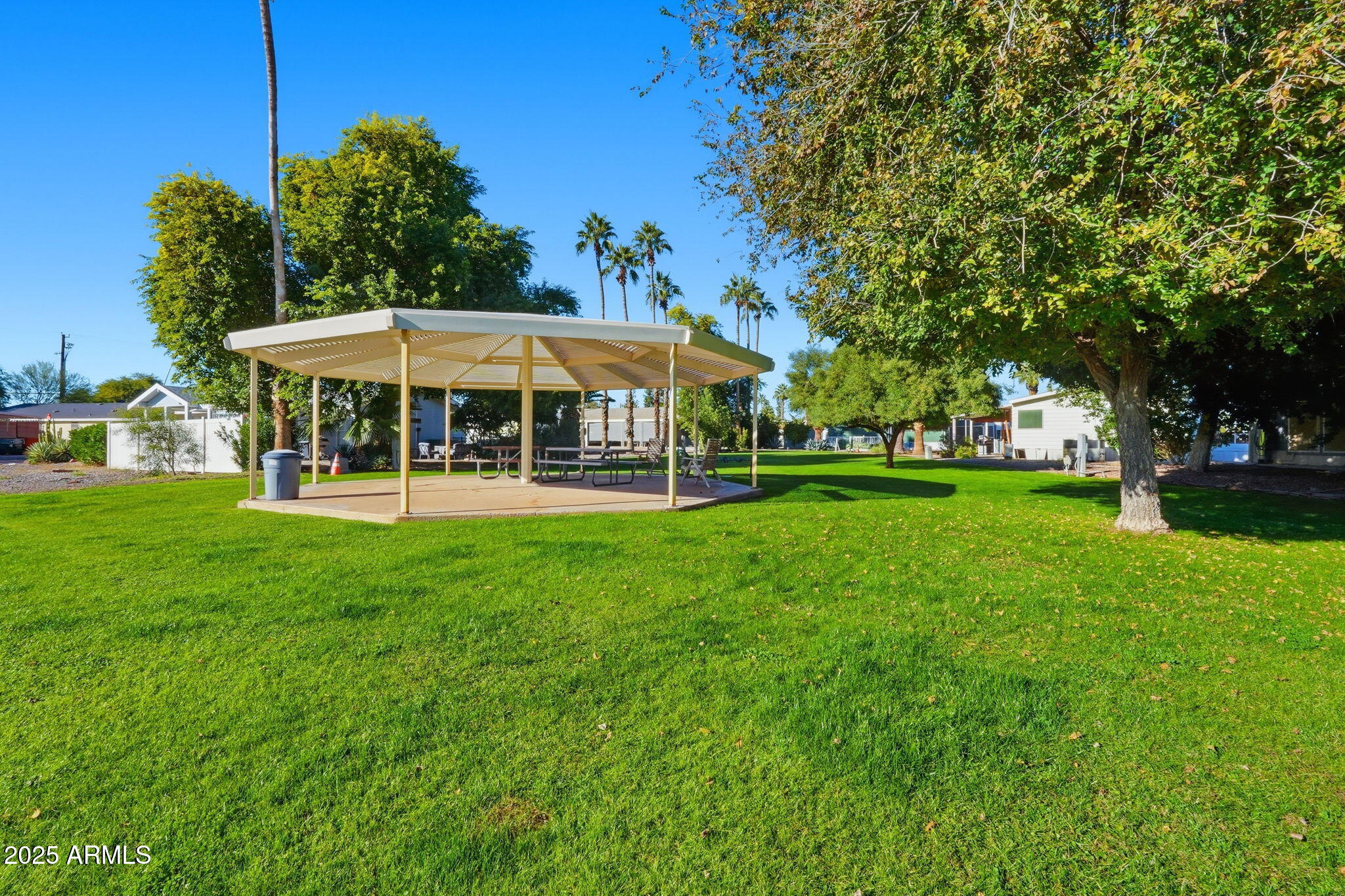 201 South Greenfield Road, Unit 142 Mesa, AZ 85206 - Photo 48 of 53 a view of a house with a yard