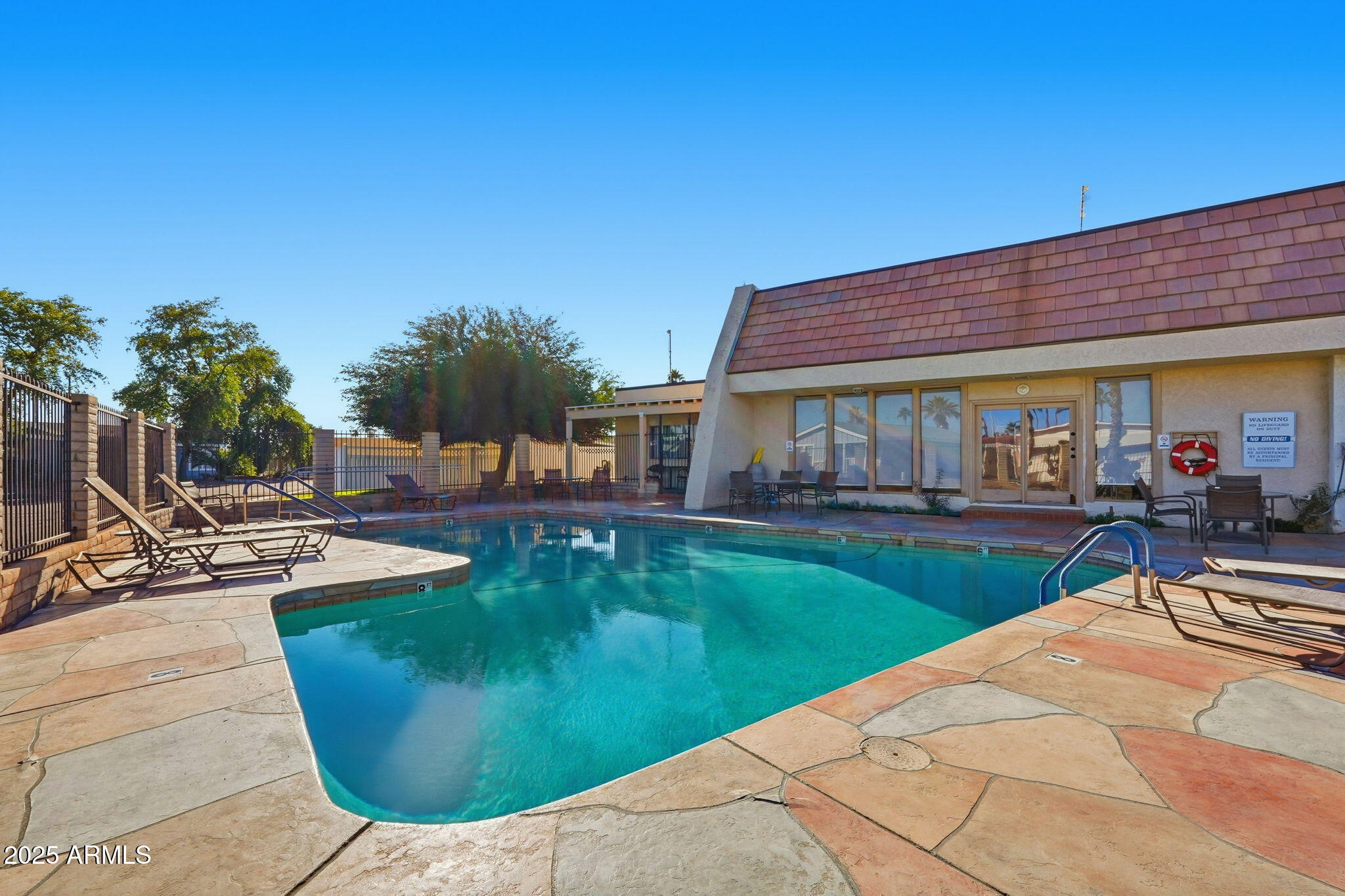 201 South Greenfield Road, Unit 142 Mesa, AZ 85206 - Photo 50 of 53 a view of a house with swimming pool and sitting area