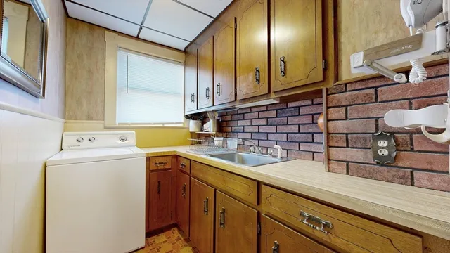 a view of a kitchen with utility and utility