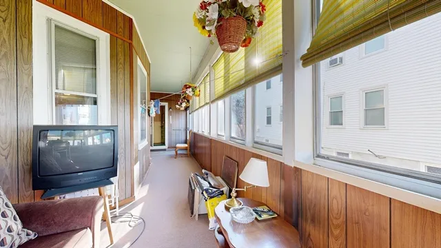 a view of living room with furniture and a window