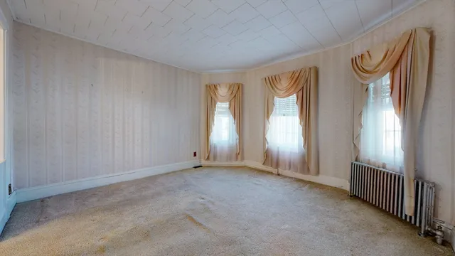 a view of an empty room and window
