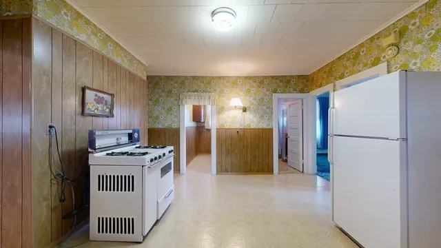 a kitchen with refrigerator and stove