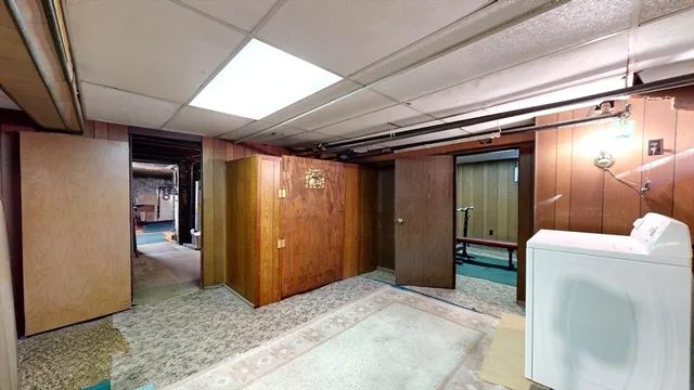 a room with furniture and gym equipment