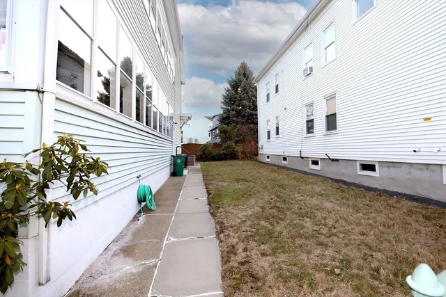 a view of a backyard with potted plants