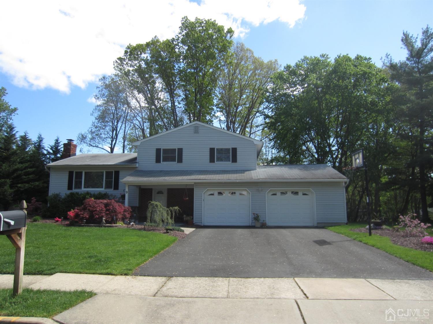 9 Tremblay Road East Brunswick, NJ 08816 - Photo 1 of 25 a front view of house with yard and trees