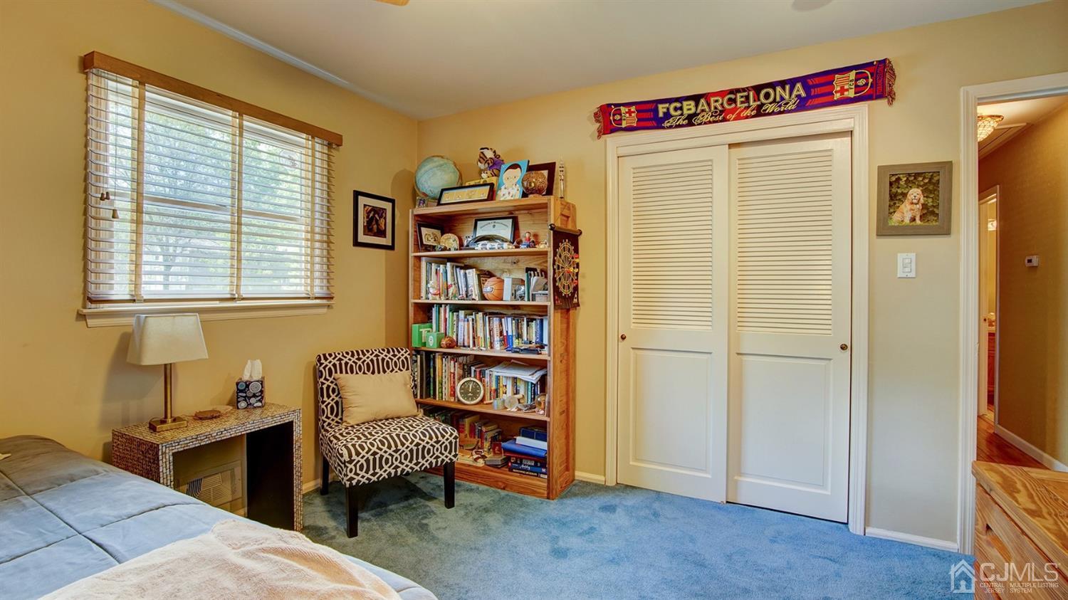 9 Tremblay Road East Brunswick, NJ 08816 - Photo 12 of 25 a bedroom with a bed and a book shelf