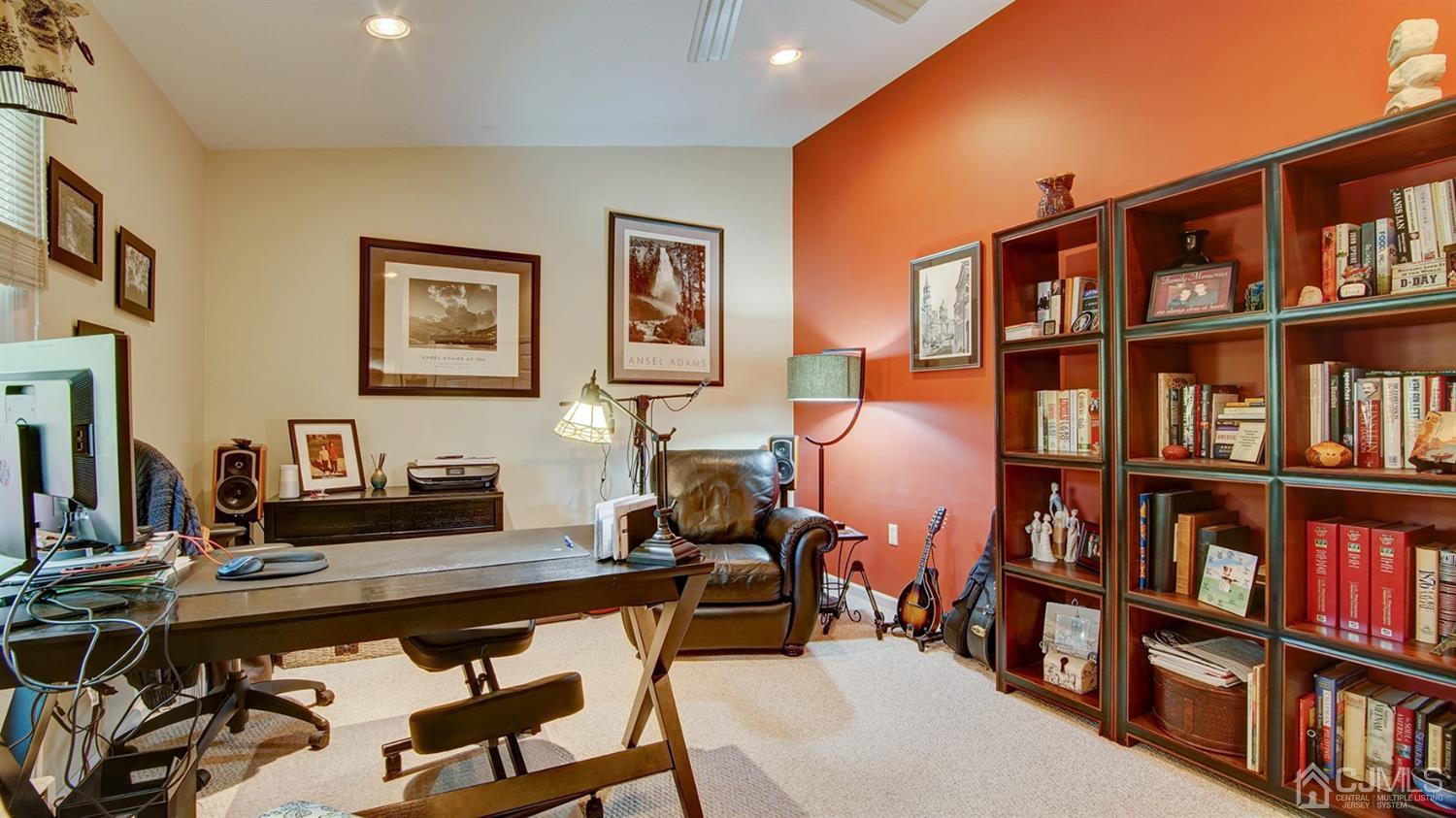 9 Tremblay Road East Brunswick, NJ 08816 - Photo 14 of 25 a living room with furniture and a book shelf