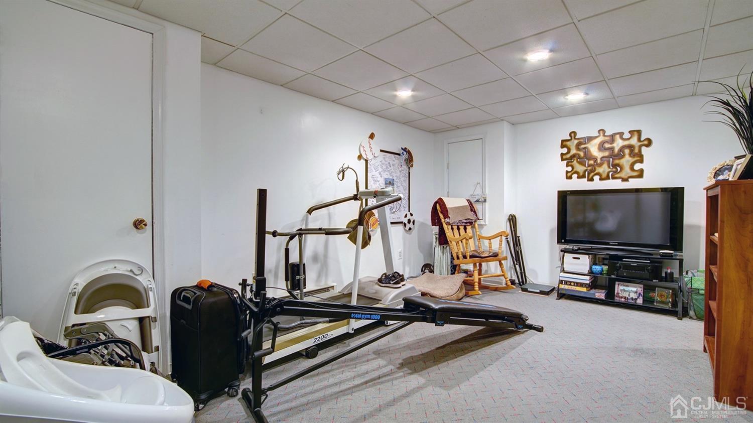 9 Tremblay Road East Brunswick, NJ 08816 - Photo 17 of 25 a view of a room with gym equipment