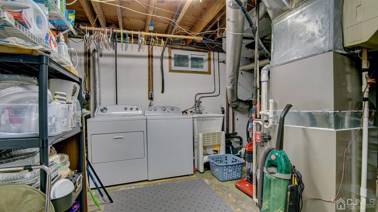 9 Tremblay Road East Brunswick, NJ 08816 - Photo 19 of 25 a utility room with cabinets