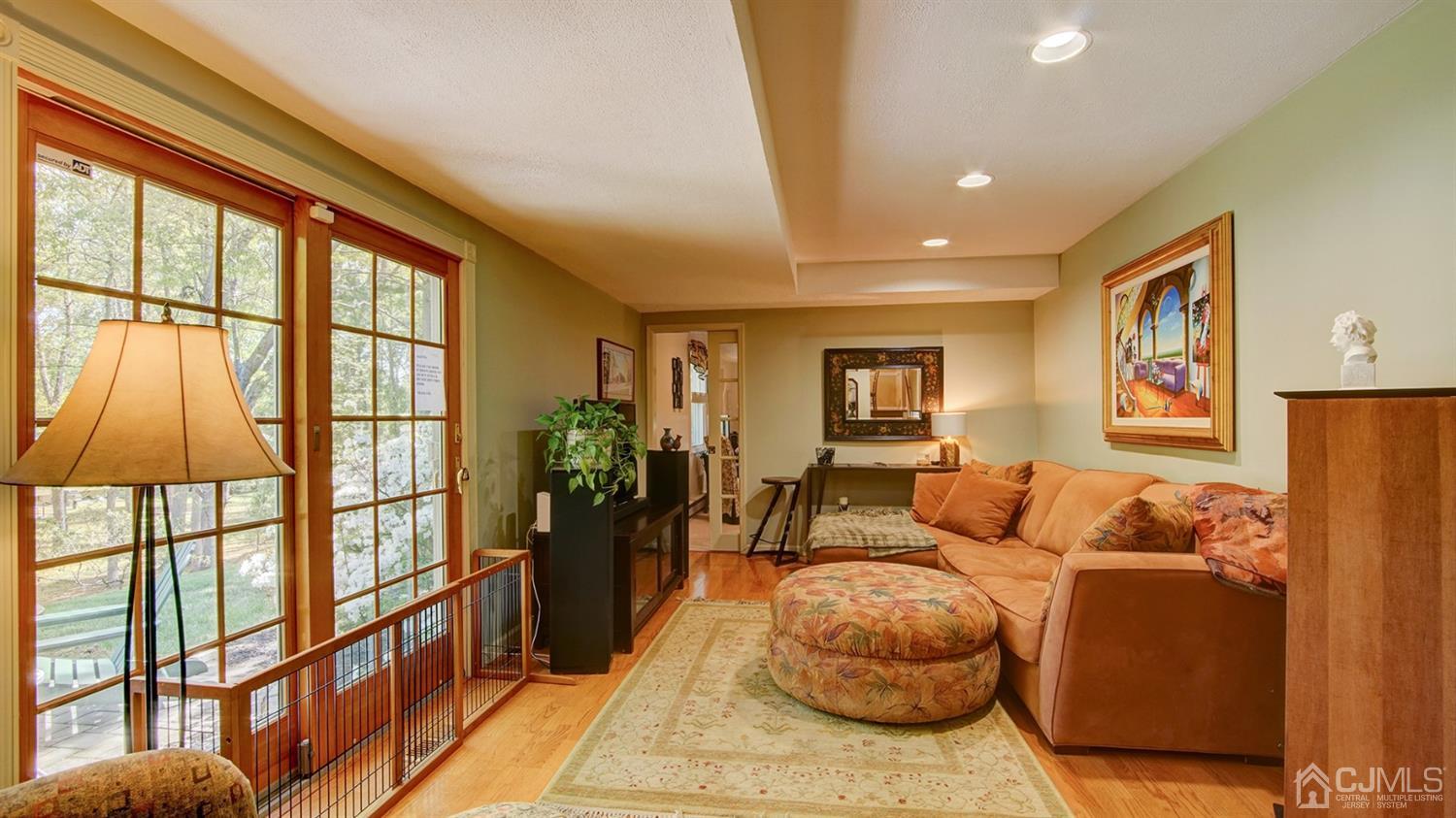 9 Tremblay Road East Brunswick, NJ 08816 - Photo 7 of 25 a living room with furniture and a flat screen tv