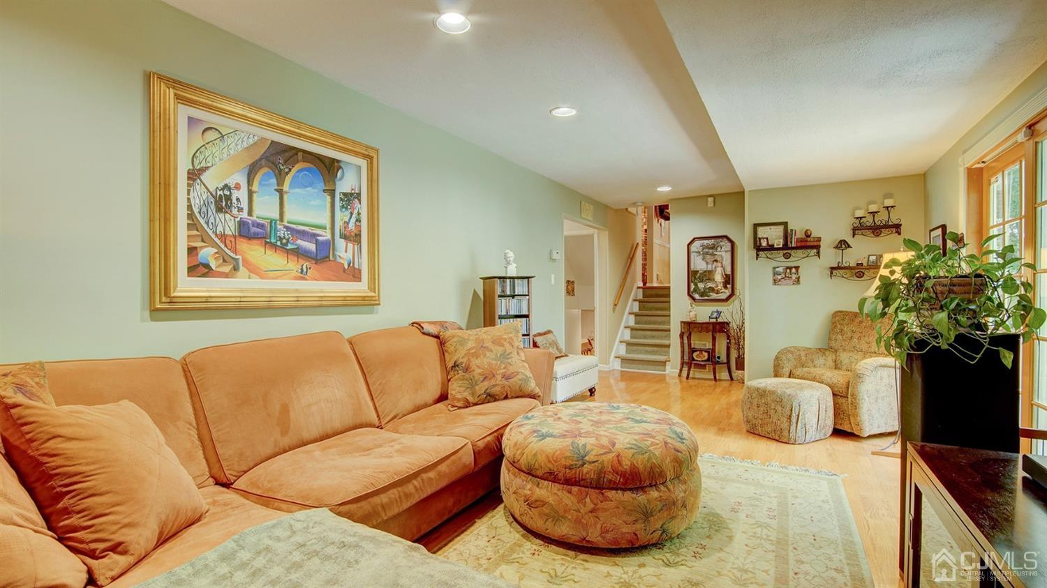 9 Tremblay Road East Brunswick, NJ 08816 - Photo 8 of 25 a living room with furniture and a flat screen tv