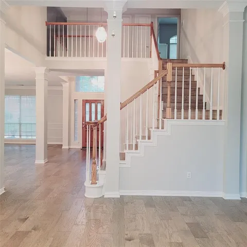 a view of an entryway with wooden floor
