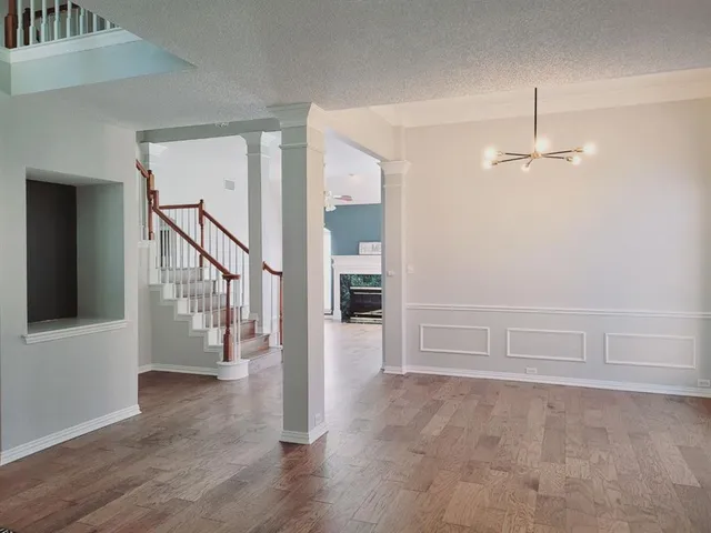 a view of an entryway with wooden floor