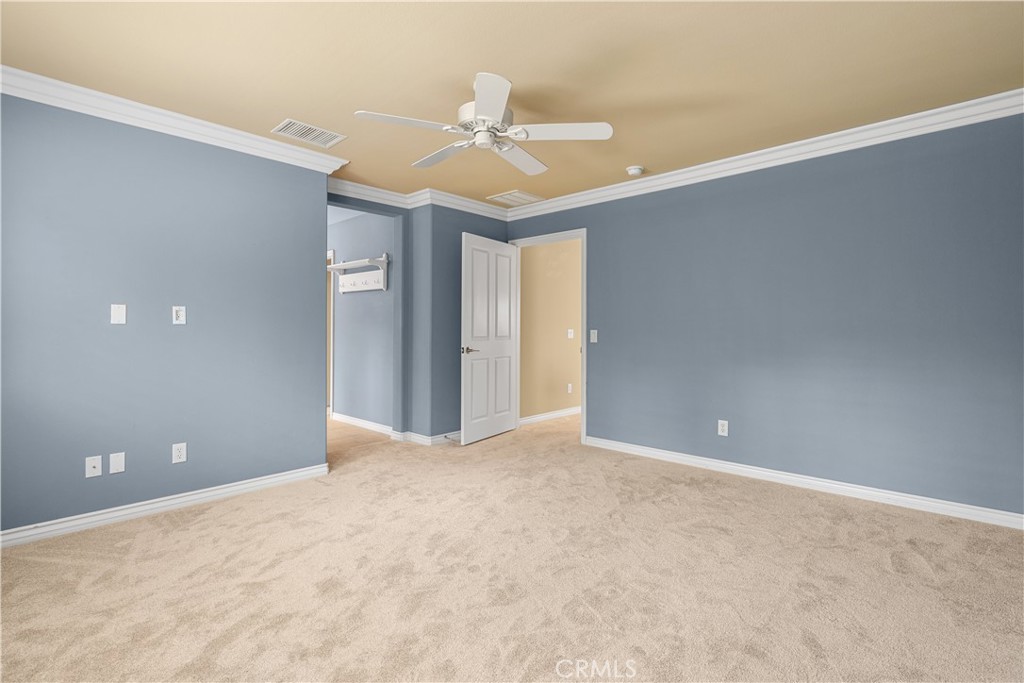 17408 Winter Pine Way Canyon Country, CA 91387 - Photo 18 of 29 a view of an empty room with a chandelier fan