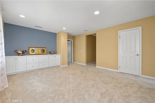 a view of a room with cabinet and mirror