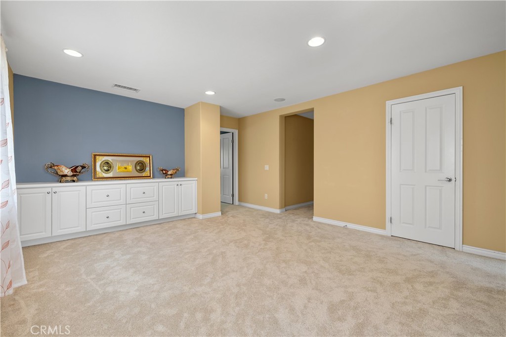 17408 Winter Pine Way Canyon Country, CA 91387 - Photo 21 of 29 a view of a room with cabinet and mirror