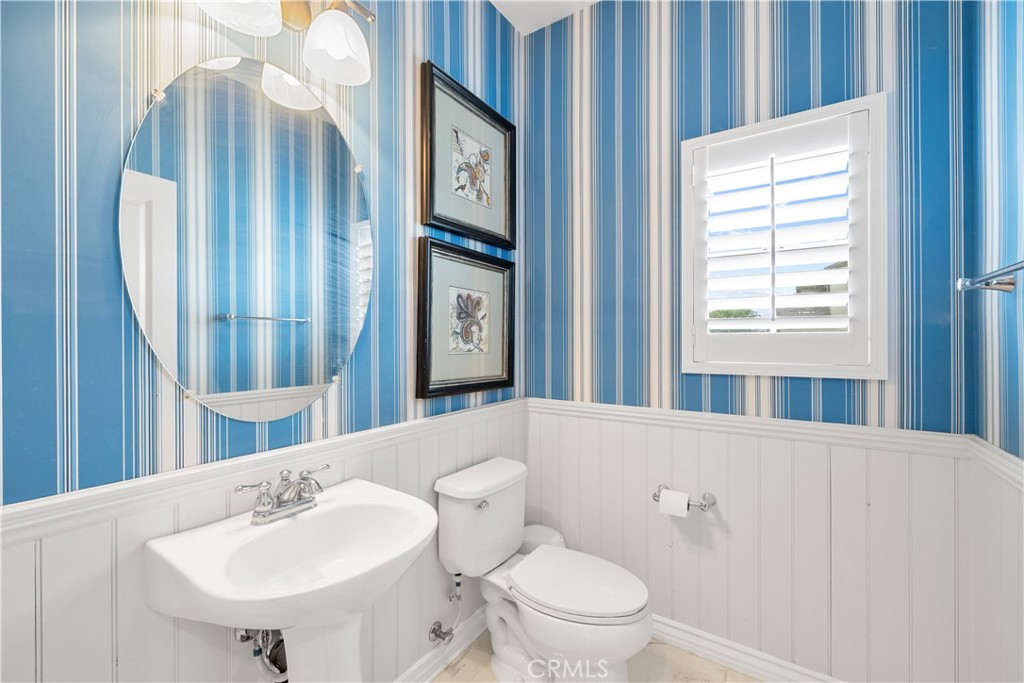 17408 Winter Pine Way Canyon Country, CA 91387 - Photo 24 of 29 a bathroom with a sink a toilet and mirror
