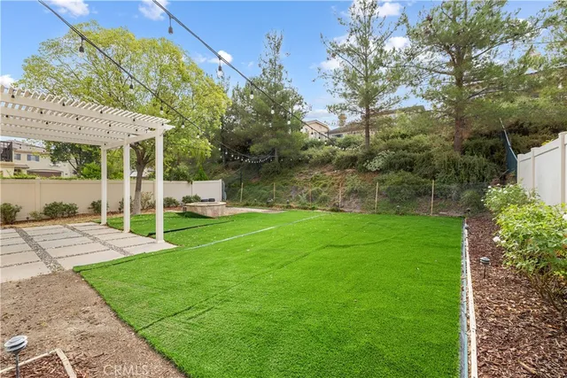 a view of a park with large trees