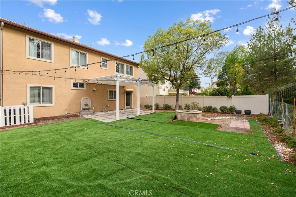 17408 Winter Pine Way Canyon Country, CA 91387 - Photo 26 of 29 a view of a house with backyard and sitting area
