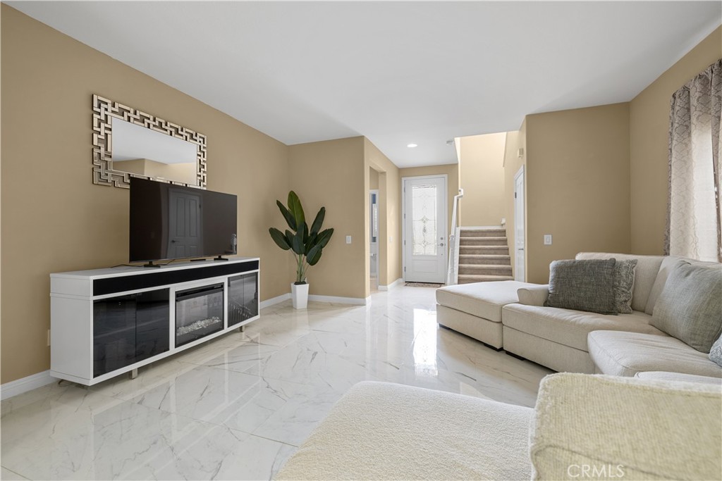 17408 Winter Pine Way Canyon Country, CA 91387 - Photo 5 of 29 a living room with furniture and a flat screen tv
