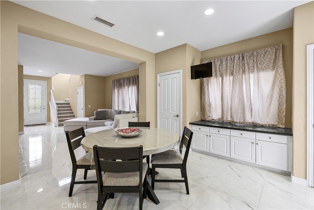 17408 Winter Pine Way Canyon Country, CA 91387 - Photo 9 of 29 a view of a dining room with furniture and window