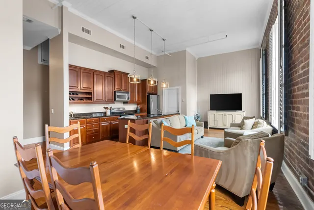 a large kitchen with a table and chairs