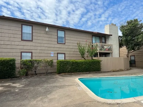 a front view of a house with yard