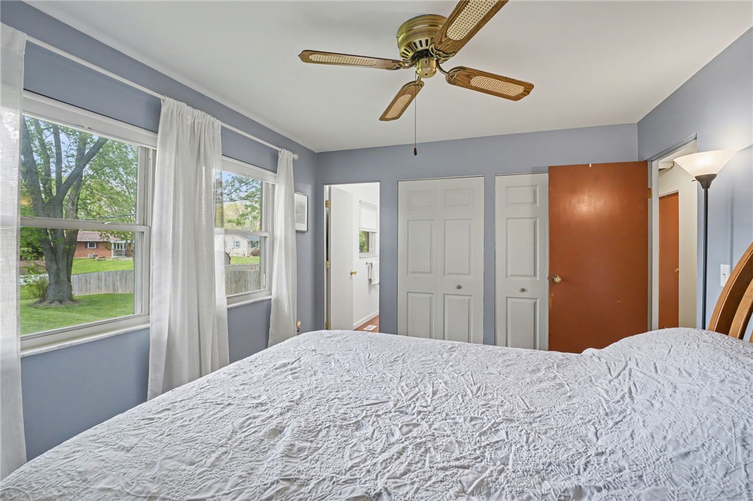 4919 Silver Arrow Drive Riverside, OH 45424 - Photo 31 of 57 This cozy bedroom features bright windows overlooking a verdant yard.