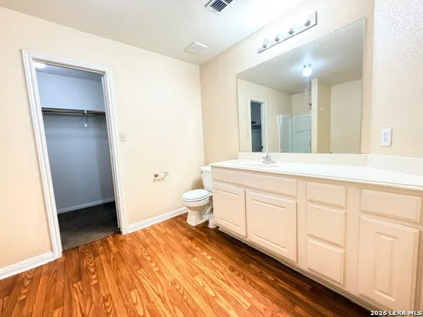 a spacious bathroom with a bathtub shower sink and toilet