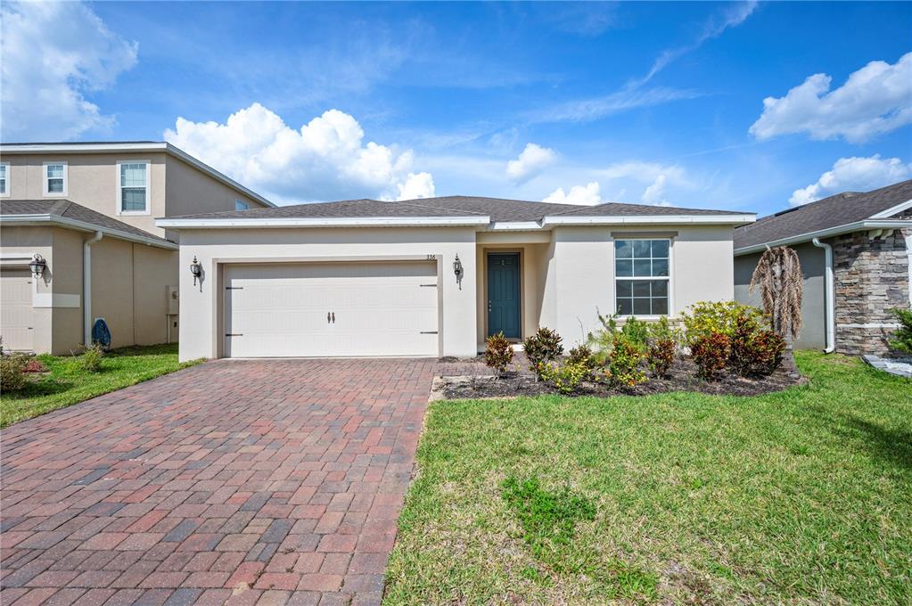 336 Summer Squall Road Davenport, FL 33837 - Photo 1 of 1 a view of a house with backyard and garden