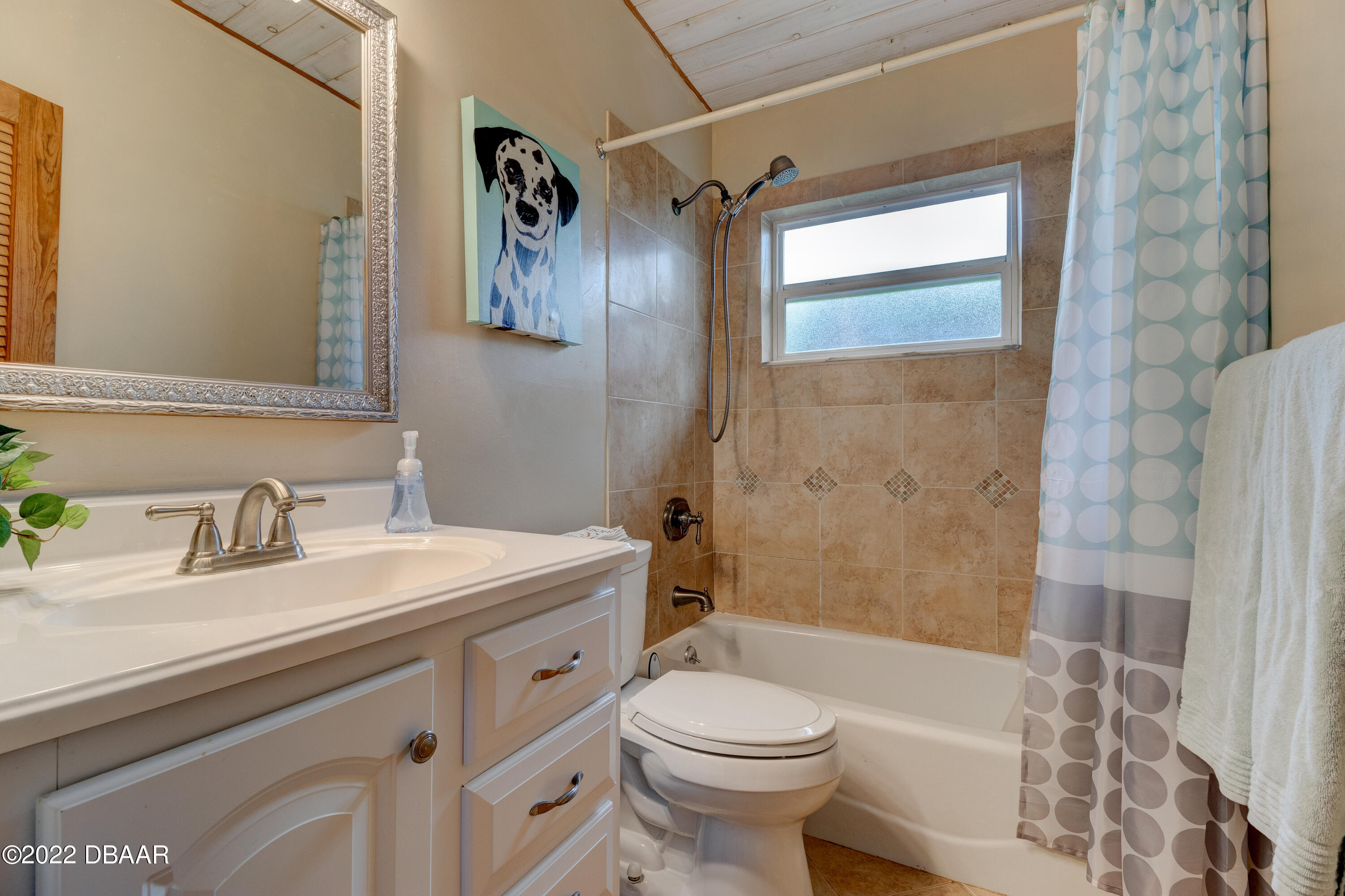 14 Maria Street Ormond Beach, FL 32176 - Photo 11 of 20 a bathroom with a sink a toilet and shower
