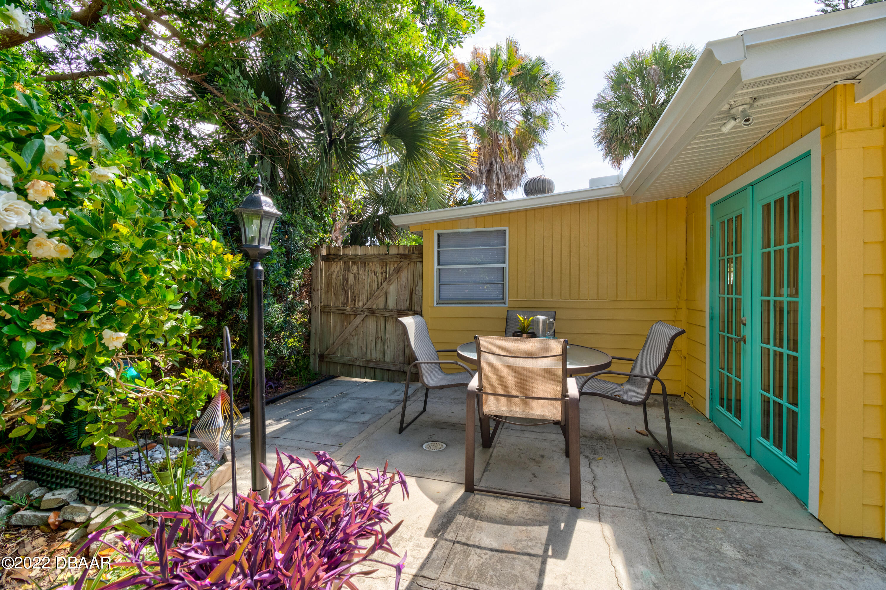 14 Maria Street Ormond Beach, FL 32176 - Photo 18 of 20 a view of a patio with table and chairs and potted plants