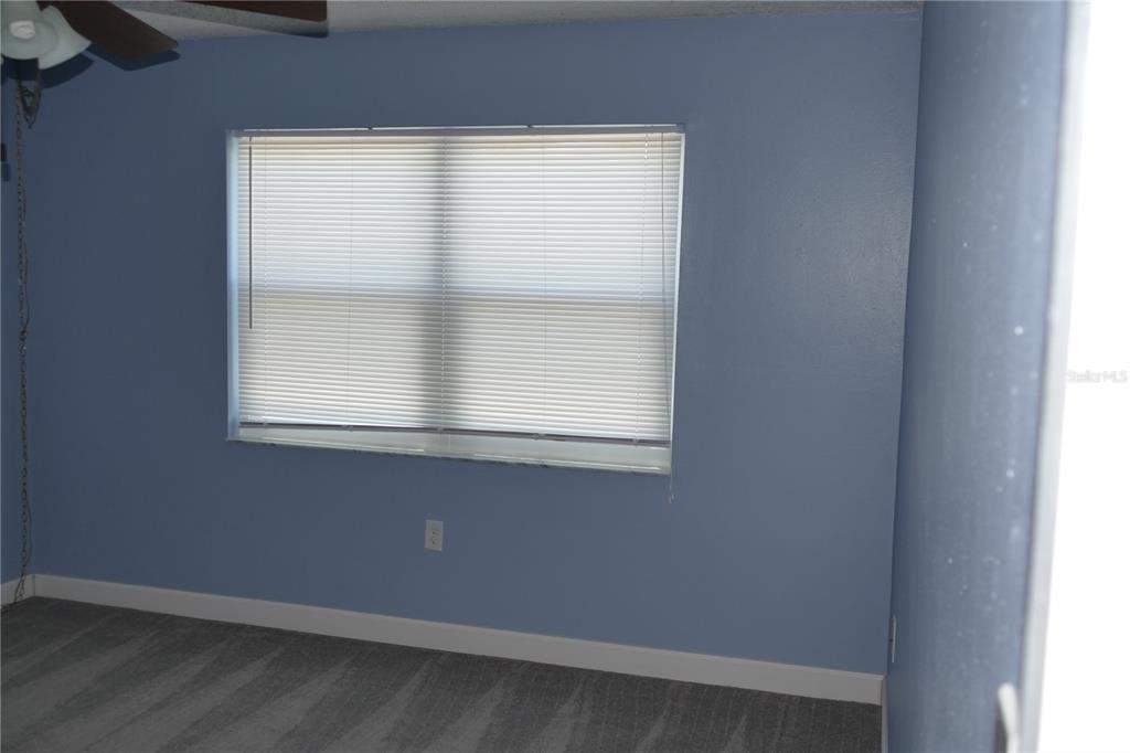 205 South McMullen Booth Road, Unit 203 Clearwater, FL 33759 - Photo 12 of 21 an empty room with a window