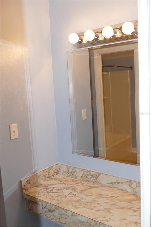 205 South McMullen Booth Road, Unit 203 Clearwater, FL 33759 - Photo 13 of 21 a view of a bathroom with a sink