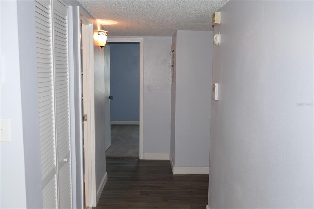 205 South McMullen Booth Road, Unit 203 Clearwater, FL 33759 - Photo 7 of 21 a view of a hallway with wooden floor