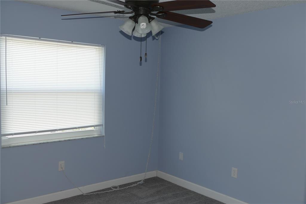 205 South McMullen Booth Road, Unit 203 Clearwater, FL 33759 - Photo 9 of 21 a small space with a window and a fan