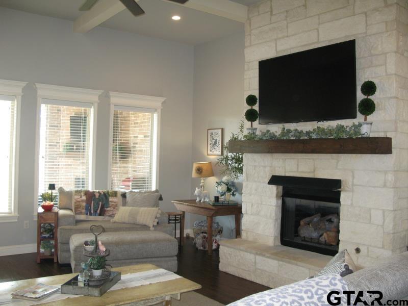 118 Nathan Road Chandler, TX 75758 - Photo 11 of 28 a living room with furniture a flat screen tv and a fireplace