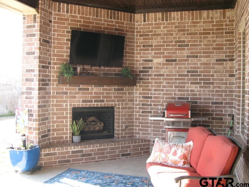 118 Nathan Road Chandler, TX 75758 - Photo 26 of 28 a living room with furniture and a fireplace