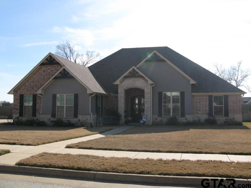 118 Nathan Road Chandler, TX 75758 - Photo 3 of 28 a front view of a house with a yard and garage