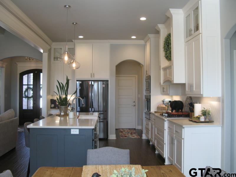 118 Nathan Road Chandler, TX 75758 - Photo 7 of 28 a kitchen with sink refrigerator and cabinets