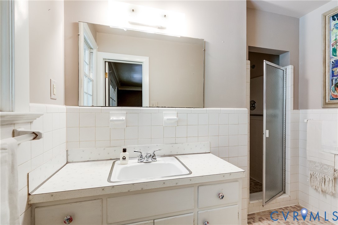 10475 Cherokee Road Richmond, VA 23235 - Photo 40 of 74 Bathroom featuring a vanity with an integrated sin
