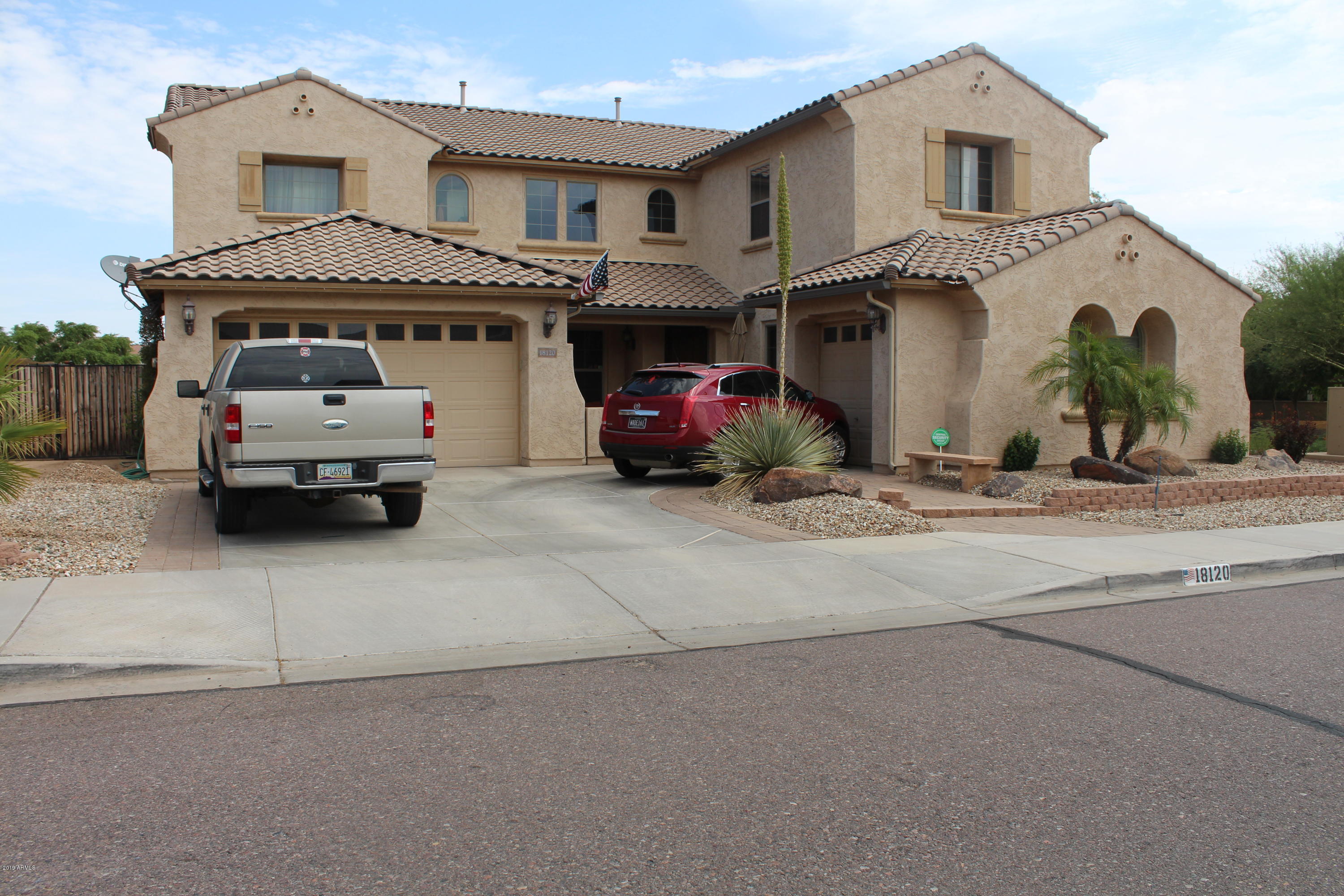 18120 West Ruth Avenue Waddell, AZ 85355 - Photo 1 of 21 a front view of a house with a parking space