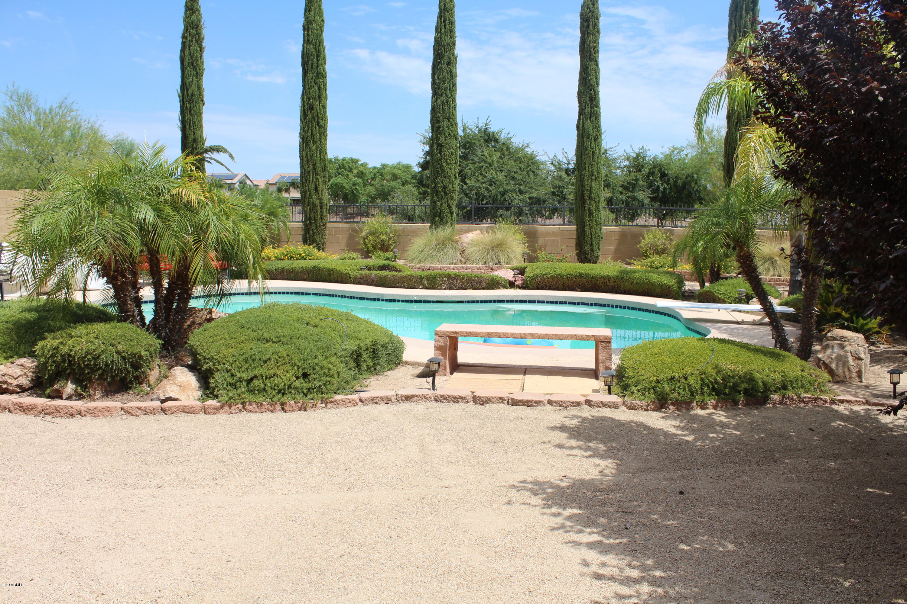18120 West Ruth Avenue Waddell, AZ 85355 - Photo 4 of 21 a view of a park with palm trees