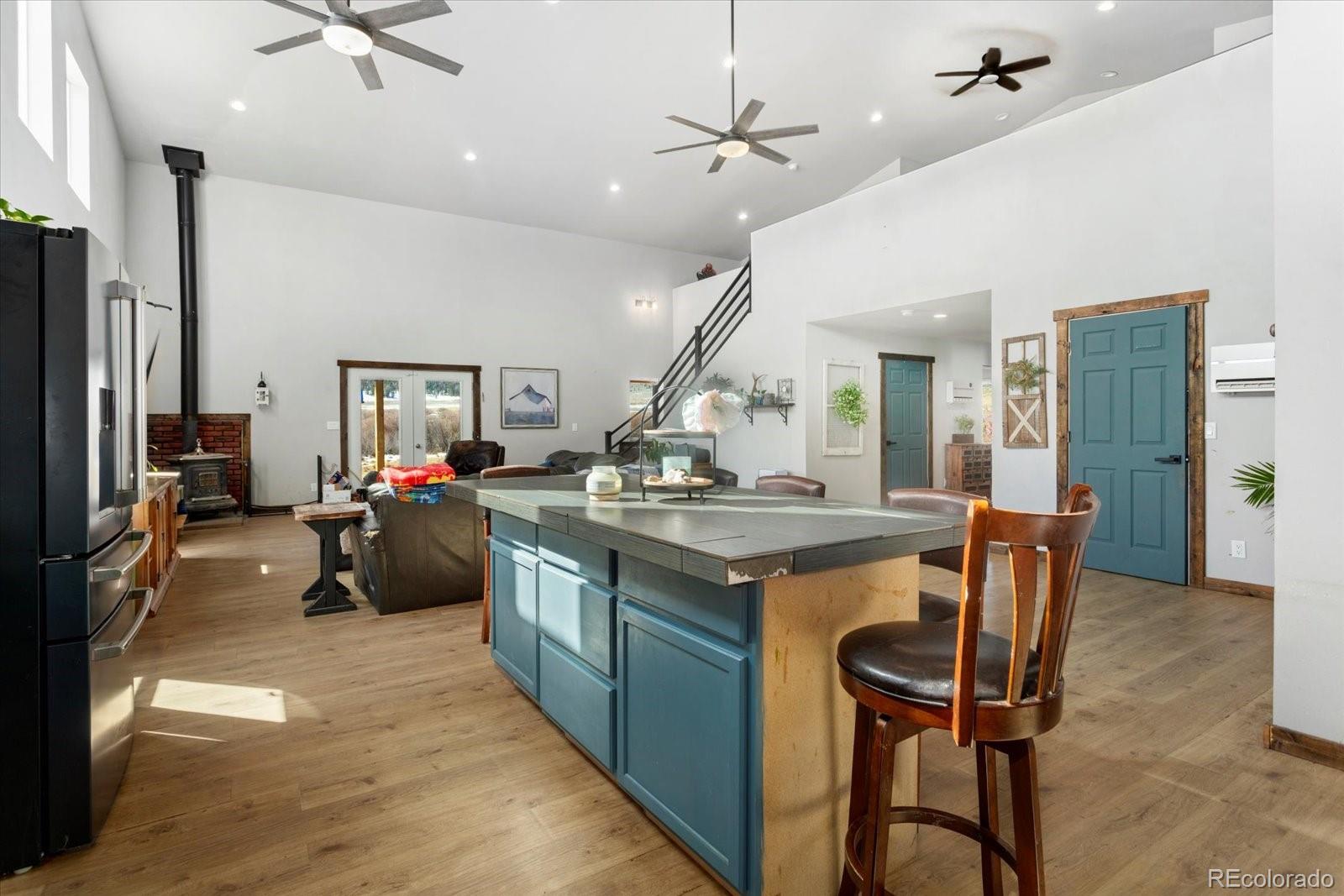 51624 Co Road Villa Grove, CO 81155 - Photo 11 of 50 a kitchen with stainless steel appliances granite countertop a stove and refrigerator