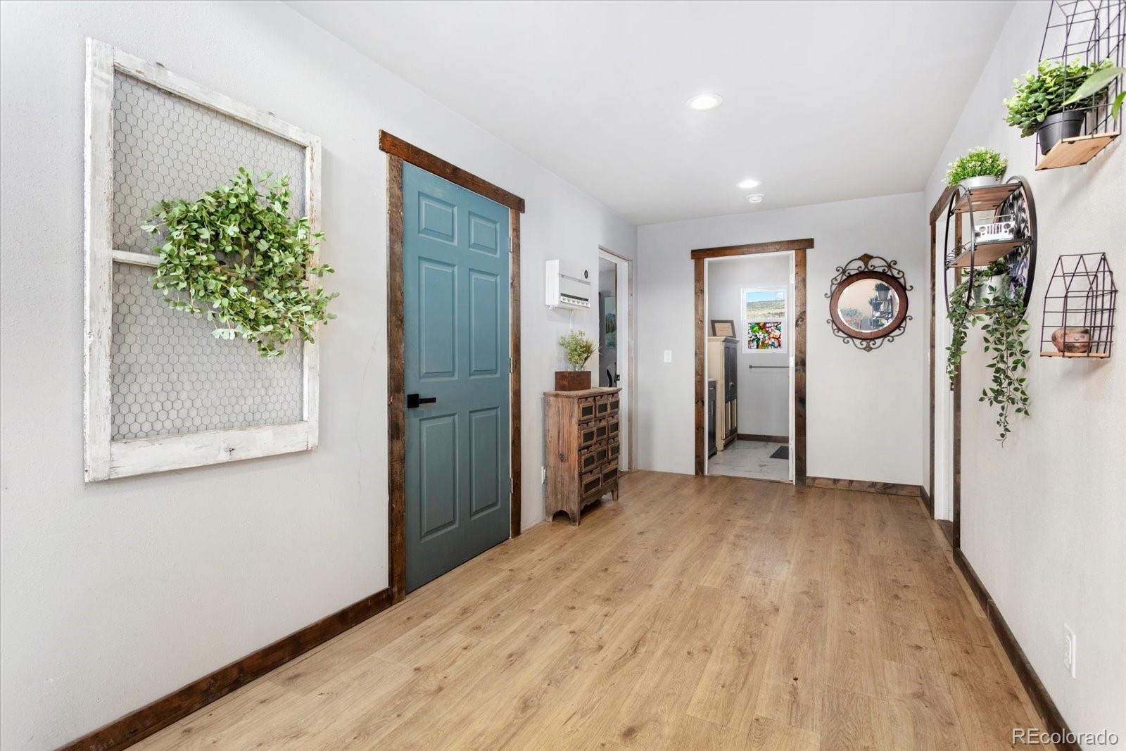 51624 Co Road Villa Grove, CO 81155 - Photo 13 of 50 a view of livingroom with hardwood floor and hallway